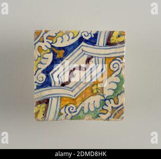 Tile, Glazed earthenware, Portion of a design composed of strap-work, painted in blue, yellow, green, brown, and violet., Netherlands, late 16th century, tiles, Decorative Arts, Tile Stock Photo