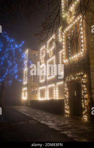 Winchester house school christmas lights in the late evening fog. Brackley, Northamptonshire, England Stock Photo