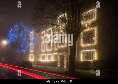 Winchester house school christmas lights in the late evening fog. Brackley, Northamptonshire, England Stock Photo