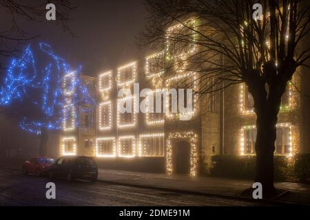 Winchester house school christmas lights in the late evening fog. Brackley, Northamptonshire, England Stock Photo