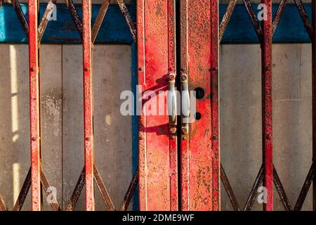 January 10, 2020 -  Alor Setar, Kedah, Malaysia: Close up detail of an old folding shutter gate in the front of a Perenakan shophouse in the city of A Stock Photo