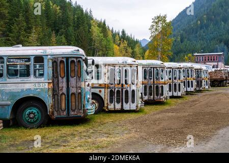 October 04, 2020 - Sandon, British Columbia, Canada: A collection of  old trolley city buses in the ghost town of Sandon, British Columbia, Canada. Sa Stock Photo