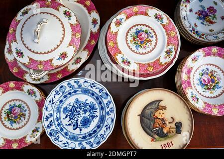 Ankara, Turkey - October, 2020: Vintage porcelain dishware plates and bowl displayed in an antique store in Ankara, Turkey. Stock Photo