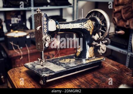 Ankara, Turkey - October, 2020: Vintage Singer sewing machine on the desk in an antique store in Ankara, Turkey. Stock Photo
