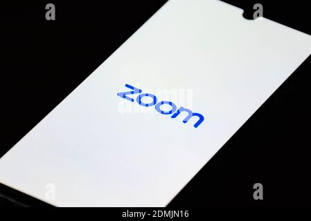 Zoom Video Communications app on the smartphone, video conferences and online chat services for meeting Stock Photo