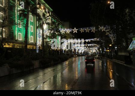 Panepistimiou street which is decorated for Christmas is empty during Covid - 19 lockdown measures in central Athens. Stock Photo
