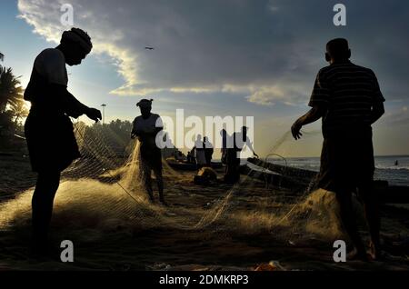 Fishermen at Kappil Beach, Varkala, Kerala, India on 2012-01-05 Stock Photo