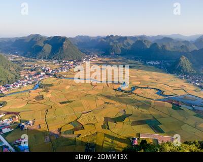 Bac Son valley with yellow rice fields in harvest season in Bac Son district, Lang Son province, Vietnam Stock Photo