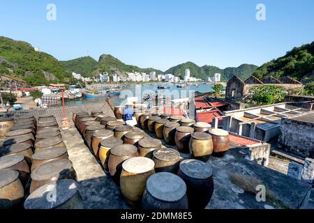 Cat Ba Island, Quang Ninh Province, Vietnam - November 13, 2020: Big production facilities fish sauce in Vietnam. Fishermen, Cat Ba Bay, profession of Stock Photo