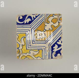 Tile, Glazed earthenware, Portion of a design composed of geometrical shapes enclosing conventionalized foilage; painted in blue, yellow, and brown., Netherlands, late 16th century, tiles, Decorative Arts, Tile Stock Photo
