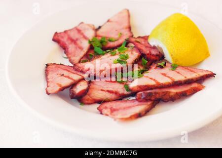 Smoked pork on the grill appetizer (selective focus) Stock Photo