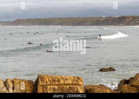 Baleal, Beira Litoral - Portugal - 13 December 2020: surfers enjoy a day of surfing at Baleal north beach in Portugal Stock Photo