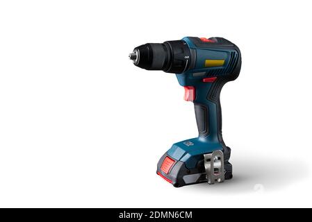 Professional cordless drill close-up on a white background. Isolated. Free space for the text. For advertisements, catalogs, and the Internet. Stock Photo
