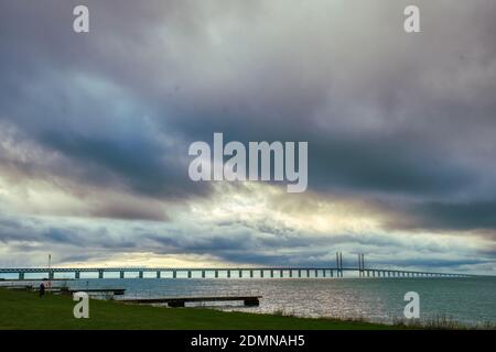 The Oresund Bridge in the Baltic Sea against a dramatic sky. The Oresundsbron is a connection between Sweden and Denmark across the Oresund Strait Stock Photo