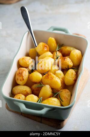 Roasted Young Potatoes with Rosemary ready to eat. Stock Photo