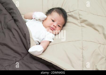 Indian baby naked resting back white background - MR#512 Stock Photo