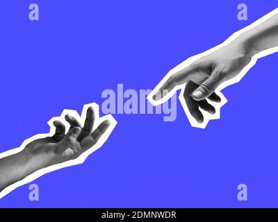 Two hands reaching out towards each other isolated on purple background. Stock Photo