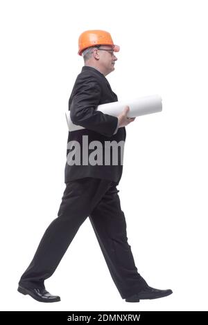 Side view of happy engineer walking isolated on white background Stock Photo