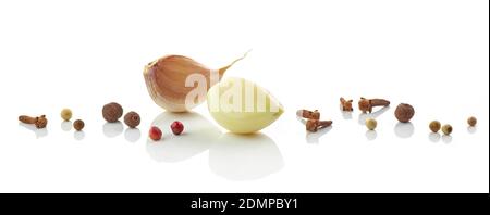 garlic cloves and various spices isolated on white background Stock Photo