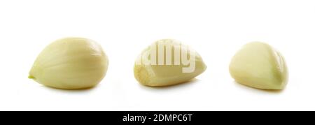 three garlic cloves macro isolated on white background Stock Photo