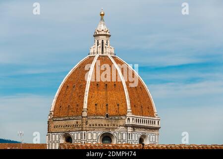 Lovely close-up view of Florence Cathedral's octagonal Dome with a cupola on top that is crowned with a gilt copper ball and cross, providing a... Stock Photo