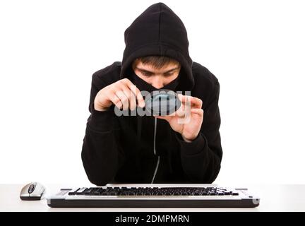 Hacker with a Computer Keyboard and Magnifying Glass Isolated on the White Background Stock Photo