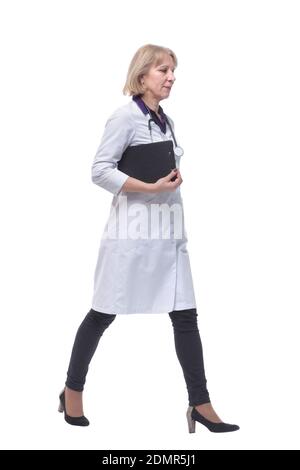 Full length portrait of medical doctor woman going straight Stock Photo