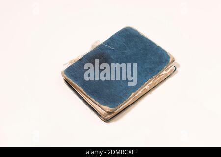 Old notebook on white background. Time and memory concept. Stock Photo