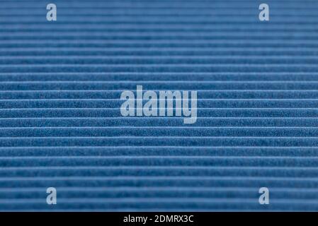 Background made of blue corrugated cardboard with horizontal stripes, shallow depth of field. Stock Photo