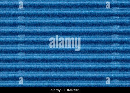 Background made of blue corrugated cardboard with horizontal stripes, view from above. Stock Photo