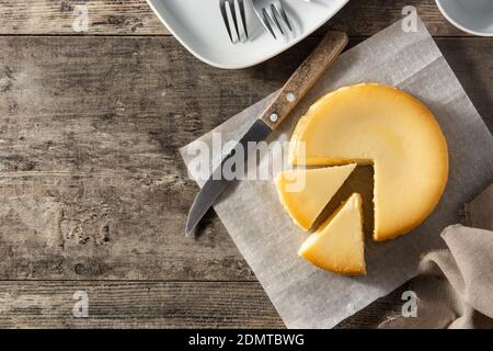 Traditional New York cheesecake on wooden table Stock Photo