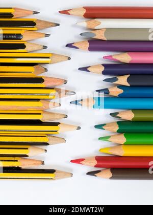 Pencils pointing towards coloured pencils Stock Photo