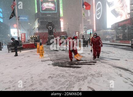New York, United States. 16th Dec, 2020. Heavy snow and high wind as first winter storm of the season hit New York. Workers shovel snow on Times Square. Forecast prediction for up to 14 inches of snow in the city when storm will move away late afternoon next day. (Photo by Lev Radin/Pacific Press) Credit: Pacific Press Media Production Corp./Alamy Live News Stock Photo