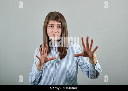 Claw hands, hand gesture and sign, scary desperate, showing claws, nails, making silly face. Stock Photo