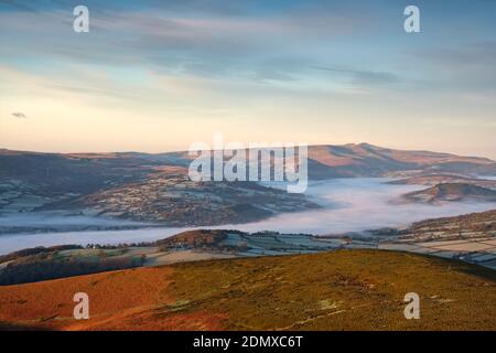 Looking west towards Pen-y-fan mountain from the top of the Sugar Loaf near Abergavenny. Stock Photo