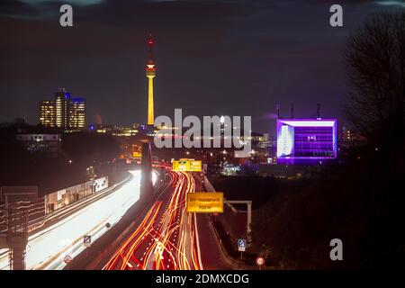 City panorama of Dortmund over motorway B1 with Florian tower, event hall Westfalenhalle and Inhouse in pink Stock Photo