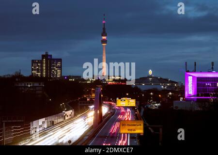 City panorama of Dortmund over motorway B1 with Florian tower, event hall Westfalenhalle and Inhouse in pink Stock Photo