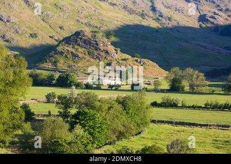 Little Langdale, Cumbria, England. View across valley floor to the rugged slopes of Wrynose Fell, early morning. Stock Photo