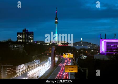 City panorama of Dortmund over motorway B1 with Florian tower, event hall Westfalenhalle and Inhouse in pink Stock Photo