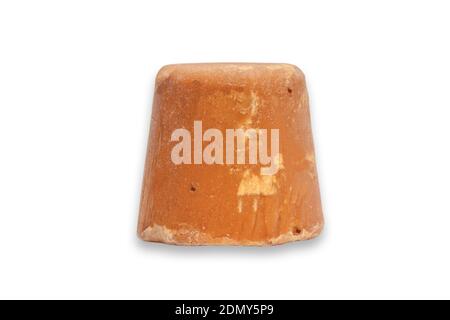 A block of Indian jiggery isolated on white background Stock Photo