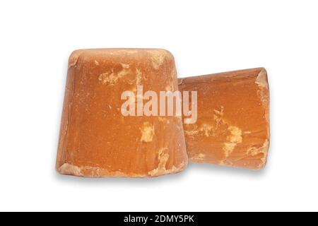 A block of Indian jiggery isolated on white background Stock Photo