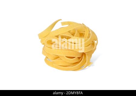 Italian pasta tagliatelle, raw and uncooked. Basic ingredient in the recipe, isolated on white. Stock Photo