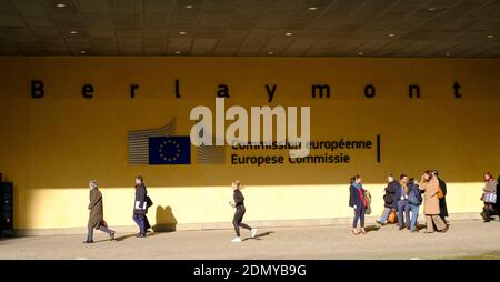 Belgium, Brussels: people walking past the Berlaymont building, headquarters of the European Commission