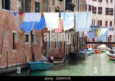 The sun sets on a canal in Venice, northern Italy Stock Photo
