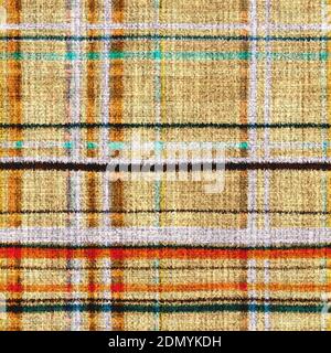 Variegated multicolor tapestry plaid woven texture. Space dyed watercolor effect knit check background. Fuzzy thin grungy textile material. Tufted Stock Photo