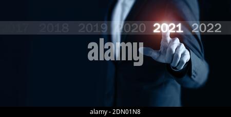 2021 business concept, business man pointing in to the 2021 new year coming Stock Photo