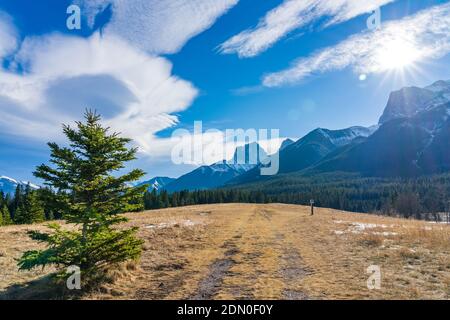 Quarry Lake Park, serene mountainside beach and dog park in late autumn season sunny day morning. Snow capped mountains with blue sky and white clouds