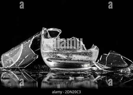 Shards of broken glasses on a black background Stock Photo