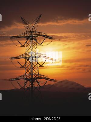 Australia. New South Wales. Hunter Valley. Electricity pylon and power lines at sunset. Stock Photo