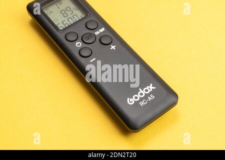 Tyumen, Russia-December 10, 2020: godox remote control video light. on a yellow background Stock Photo